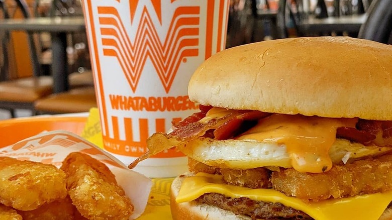 Whataburger breakfast burger with hash brown sticks and a drink