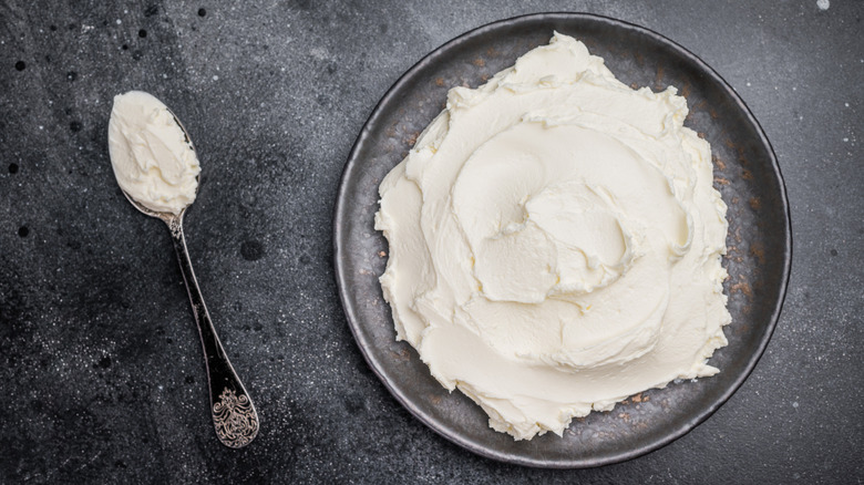 Black ceramic plate with homemade cream cheese