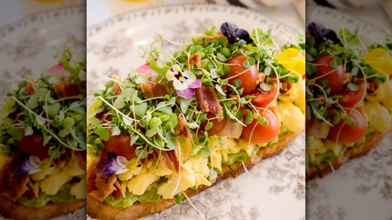Avocado toast with scrambled eggs, tomatoes, bacon, and microgreens at The Pioneer Woman Mercantile