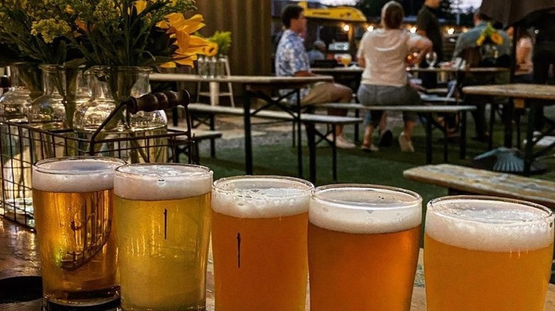 A flight of beers on the patio of Walking Stick Brewing in Houston
