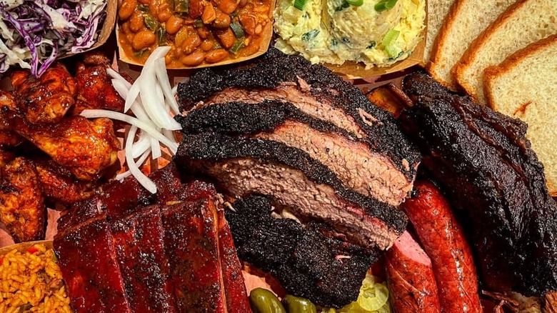 A barbecue spread featuring various meats and sides from Pinkerton's in Houston