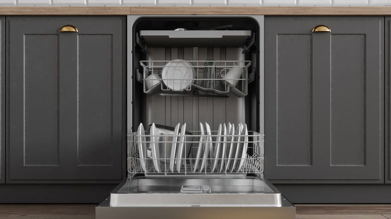 Open dishwasher with clean dishes