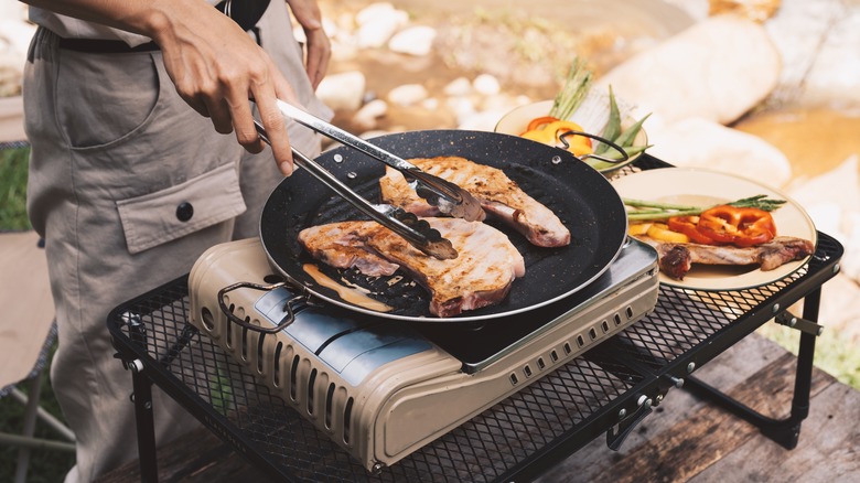 Grilling steaks outdoors