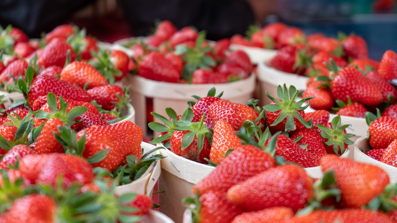 Baskets full of strawberries at a market