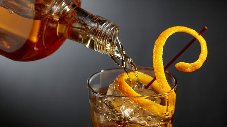 bourbon poured into drink