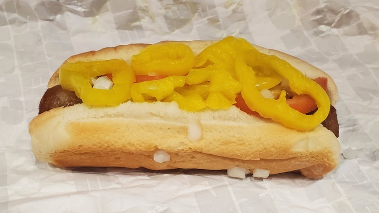 bratwurst with diced onions, tomatoes, and banana peppers from Sheetz on wrapper