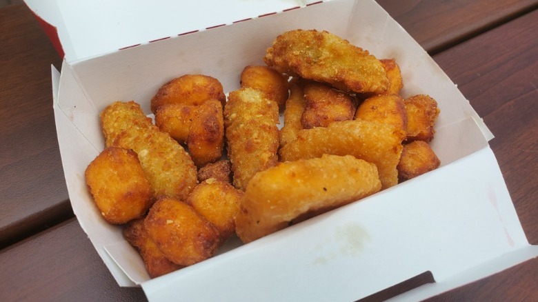 Box of Premium appetizer sampler from Sheetz on brown surface