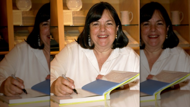 Ina Garten signing a cookbook in a store