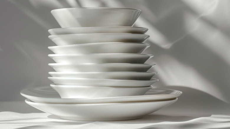 Stack of white china dishes