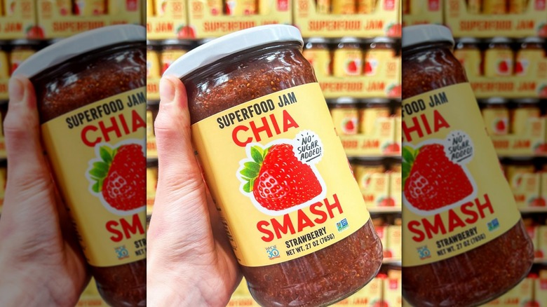 Person holding package of Strawberry chia jam in Costco