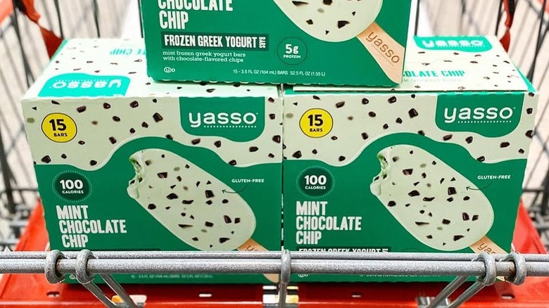 A cart full of Yasso mint chocolate chip ice cream bars in Costco