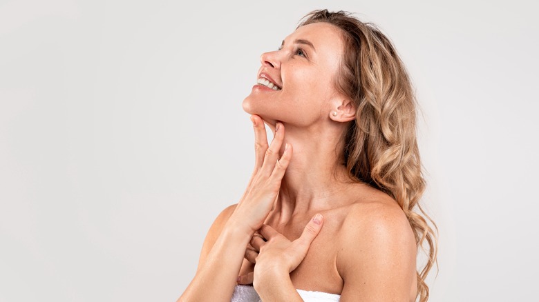 Woman touching skin