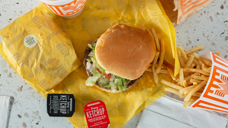 Bird's eye view of burger in a bun with fries at Whataburger