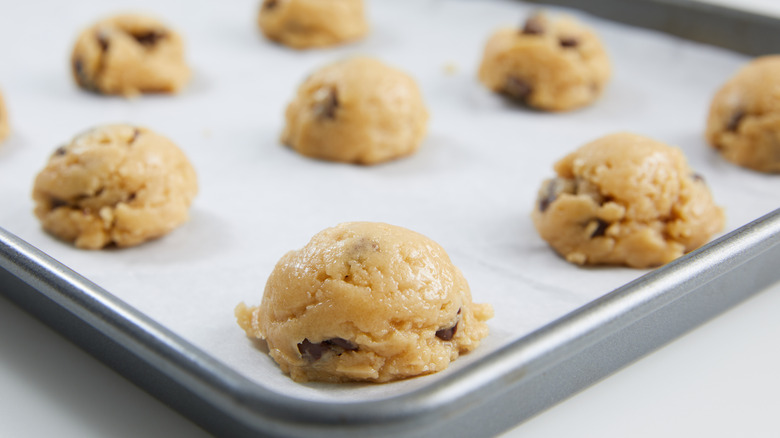 Cookie dough balls on a sheet tray