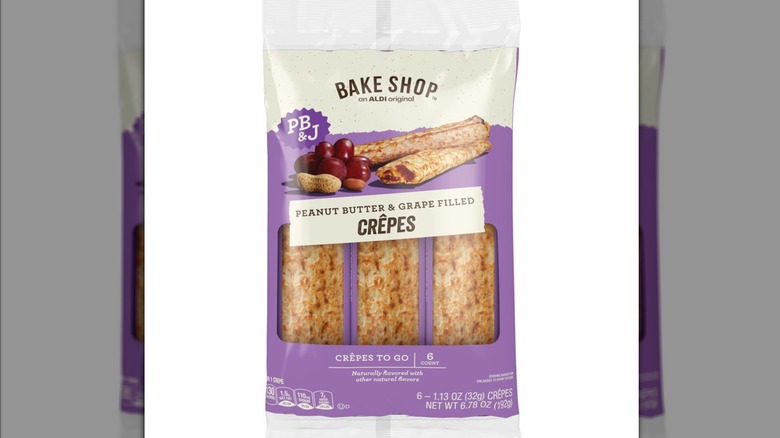 A plastic packaging containing peanut butter & grape filled crepes
