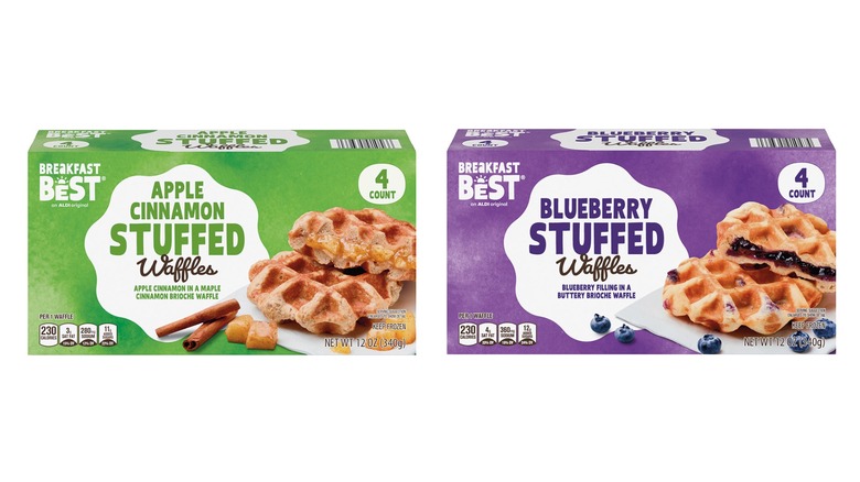Two boxes of Breakfast Best Stuffed Waffles. The green box on the left says apple cinnamon, while the purple box on the right is blueberry.