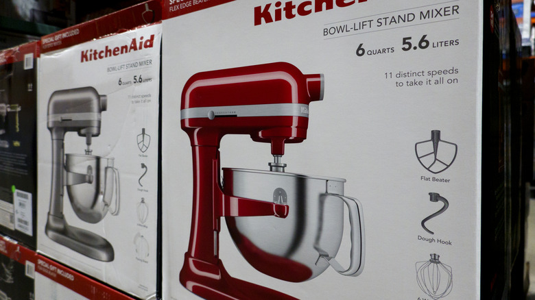 KitchenAid stand mixer boxes in an appliance store.