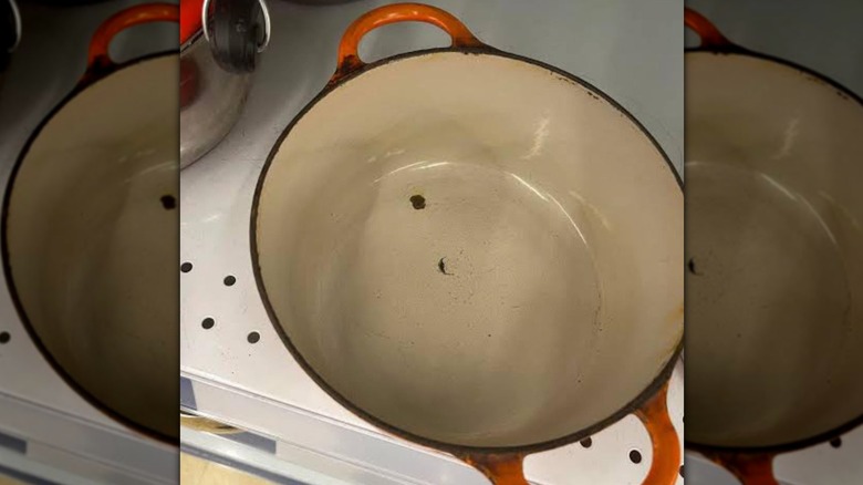 Le Creuset cast iron pot with chips in the bottom