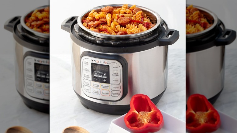 Instant pot filled with pasta, sausage, and peppers