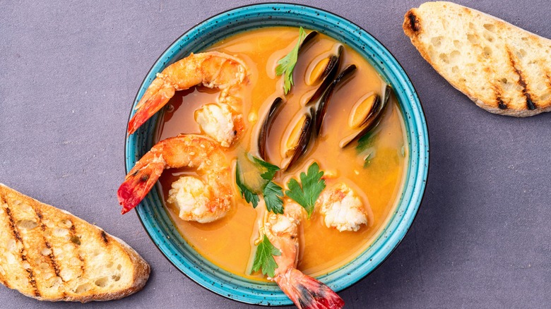 Bouillabaisse and bread slices