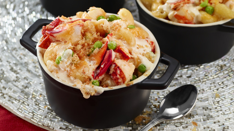 Baked lobster mac and cheese served on a table