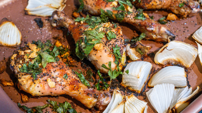 chicken cooking on sheet pan
