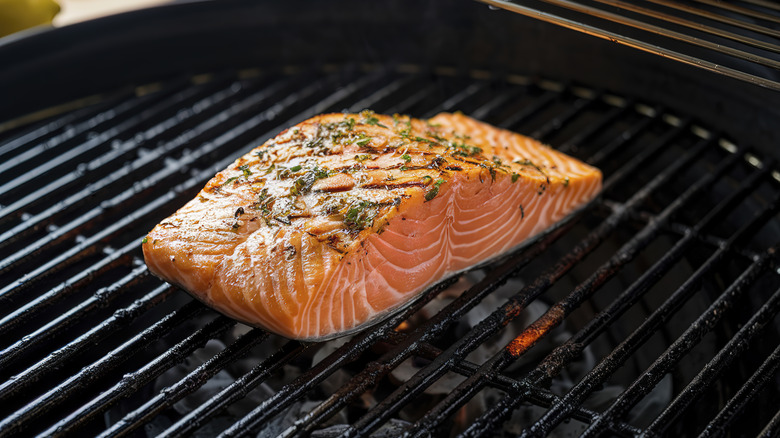 Salmon cooking on a grill
