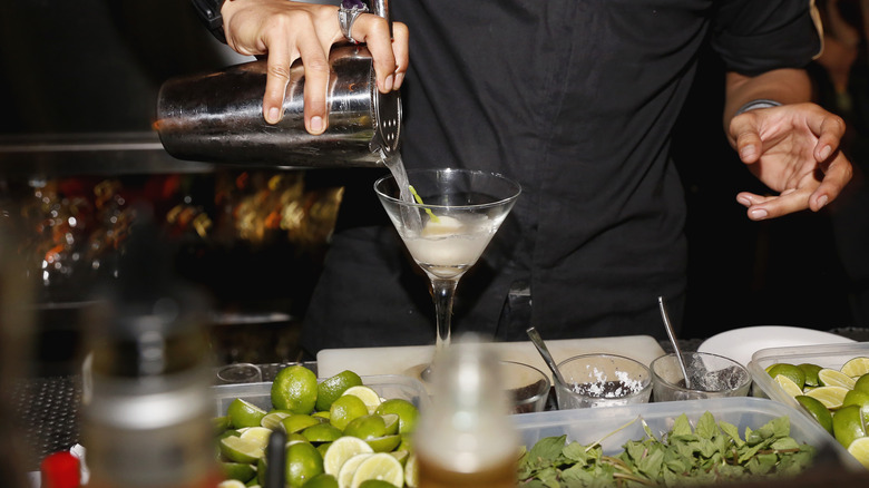 bartender pouring lychee martini