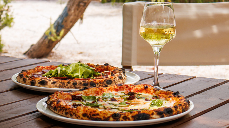 White wine and pizza outdoors
