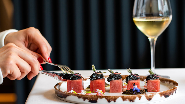 Fine dining plate with tuna, caviar and wine