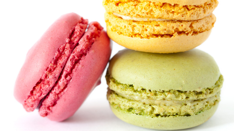 A stack of three colored macarons