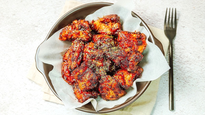 Roasted chicken pieces with gochujang and dried herbs
