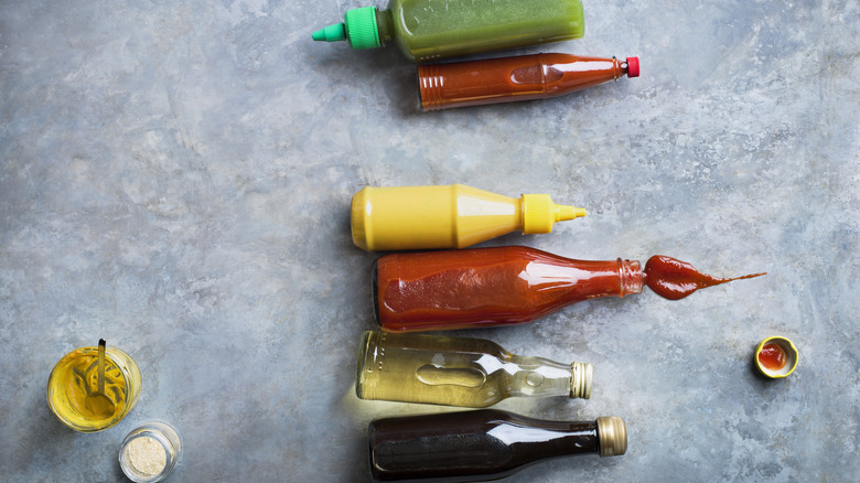Various sauce and condiment bottles