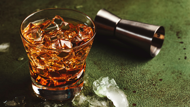 close up of Godfather cocktail with spilled ice