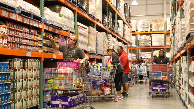 People with carts in Costco aisle