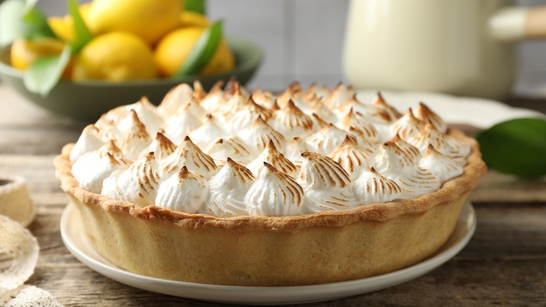 Lemon meringue pie on a wooden table