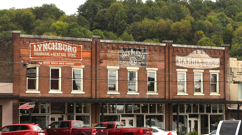 A brick building containing a series of retail stores, including a Jack Daniel's store