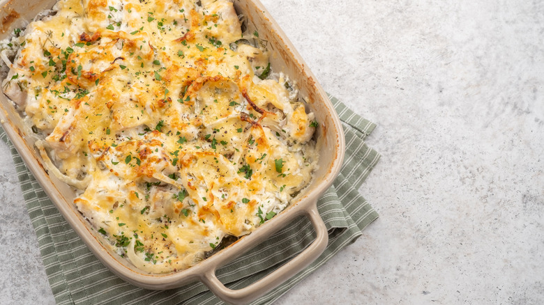 Onion casserole in pan sitting on a green pot holder