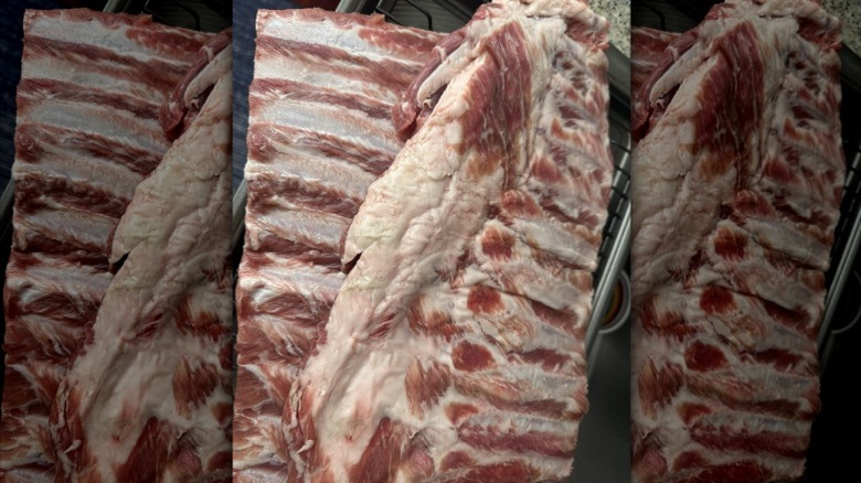 two slabs of pork ribs with shiners showing through