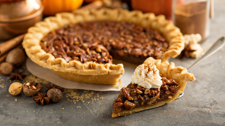 Pecan pie slice on a serving spoon