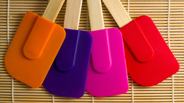 Range of colored rubber spatulas overhead