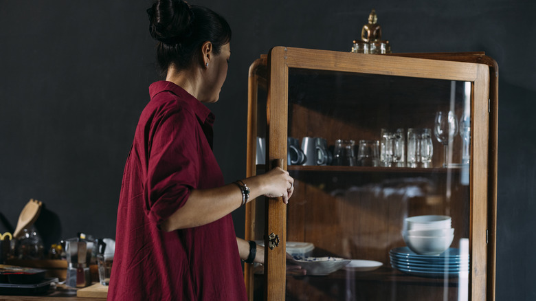 Person opening cabinet
