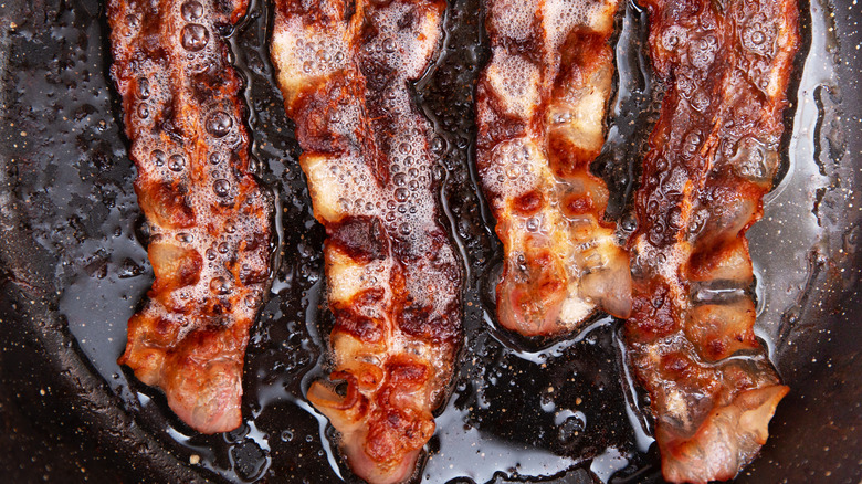 Bacon rack sizzling in grease
