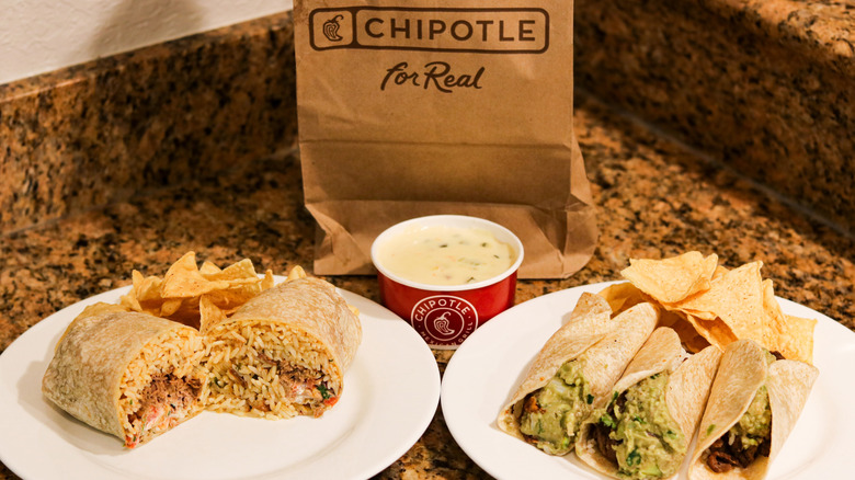 Plates of Chipotle burritos, chips, and tacos