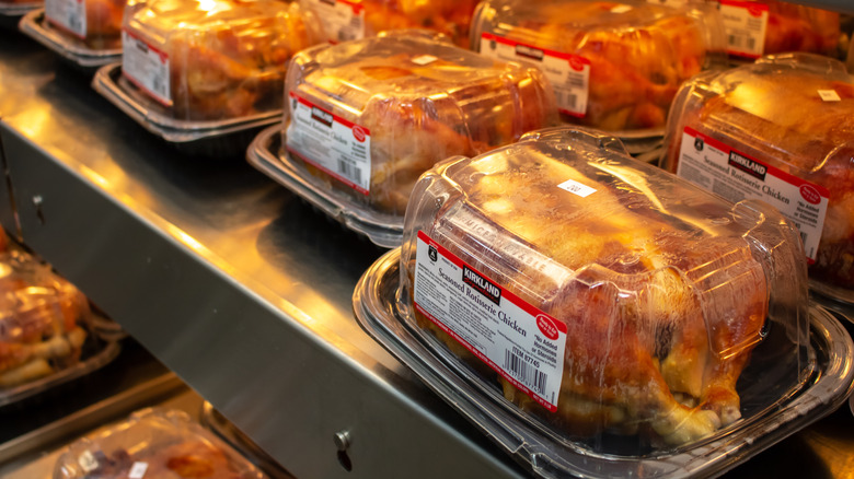 rows of clamshell plastic containers with rotisserie chickens at Costco