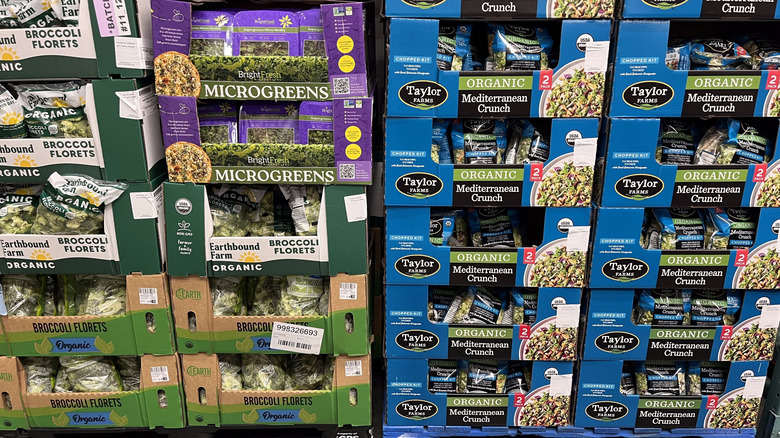 Boxes of bagged salad on display at Costco.