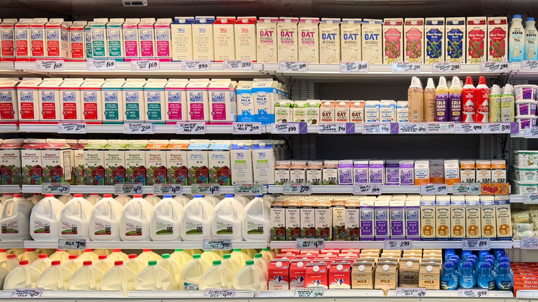 The milk shelves fully stocked at a Trader Joe's store.