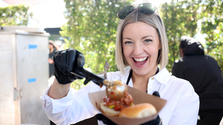 Damaris Phillips smiles while preparing sliders