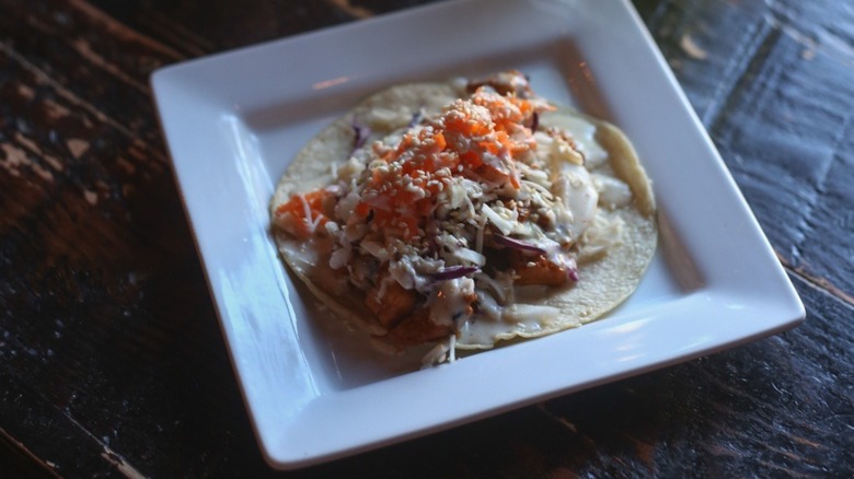 A taco on a plate at Red Star Taco in Seattle.