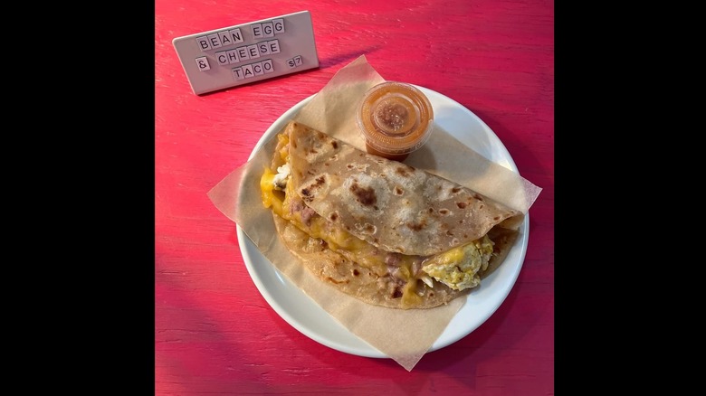 Ben, egg and cheese taco on plate from Comadre Panadería.